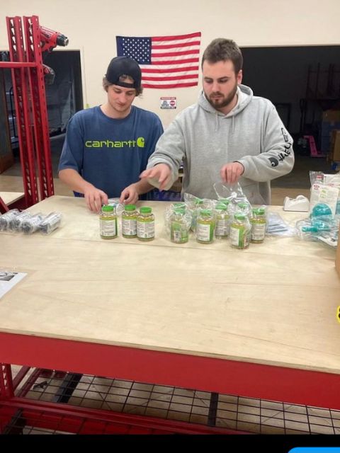 Extra Mile Prep team members poly-bagging some items for Amazon FBA prep delivery.